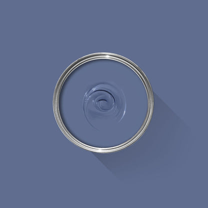 Blue paint swatch with a silver ring on a blue background