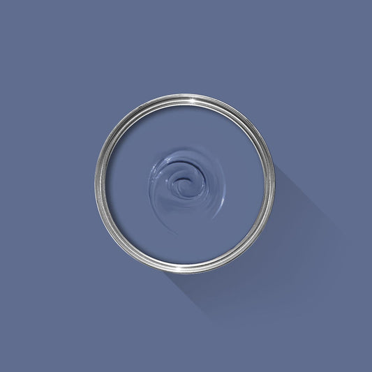 Blue paint swatch with a silver ring on a blue background