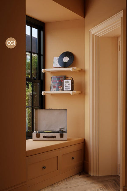 Vintage record player on a wooden shelf with vinyl records against a beige wall.