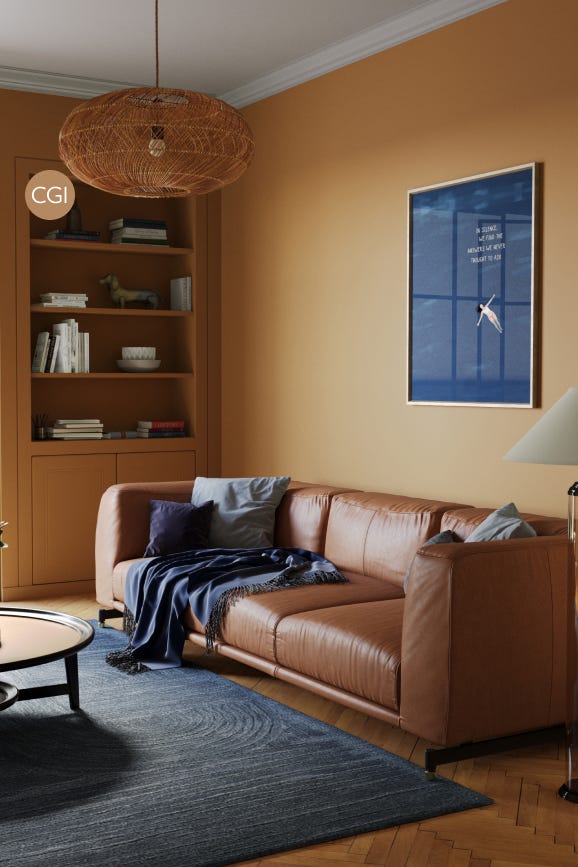 Living room with brown leather sofa, bookshelf, and framed picture on beige wall.