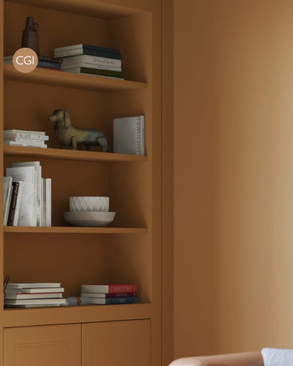 Bookshelf with books and decorative items against a beige wall