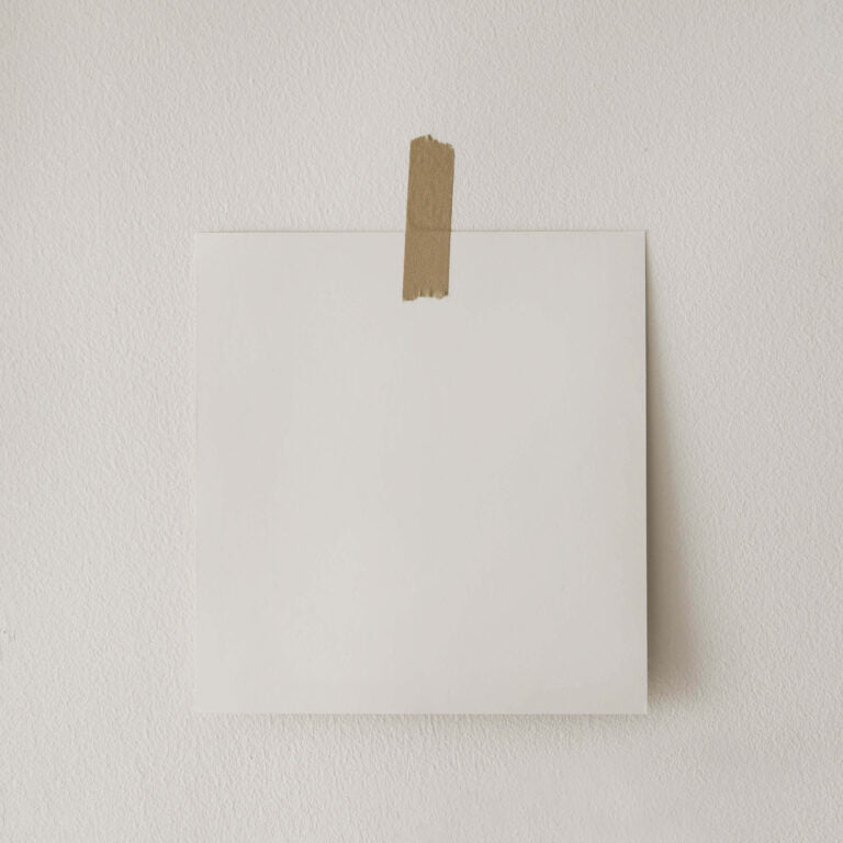 White envelope with brown tape on a light gray background