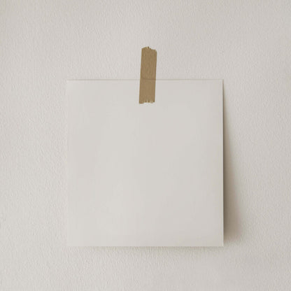 White envelope with brown tape on a light gray background