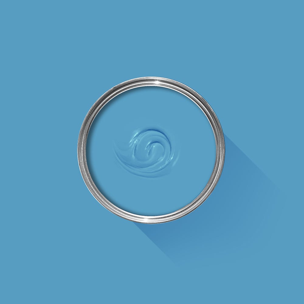 Metallic ring with water droplet design on a blue background