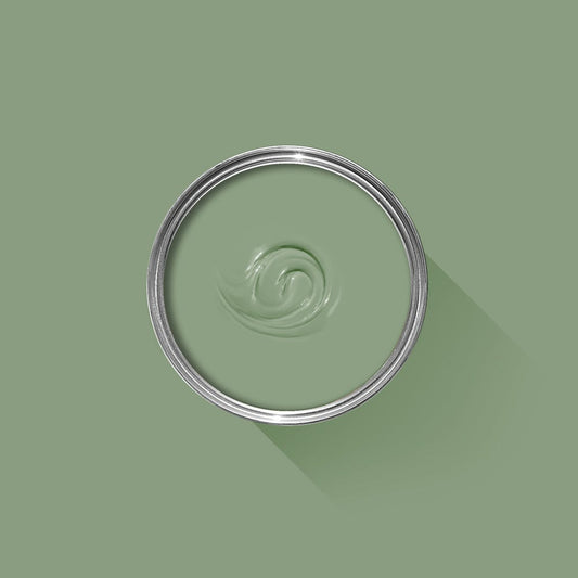 Green paint swatch with a metal lid on a green background