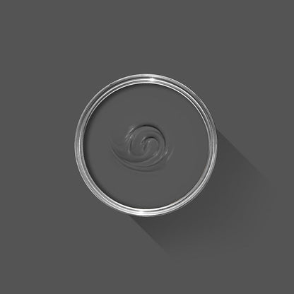 Clear plastic cup with a swirled liquid on a dark gray background