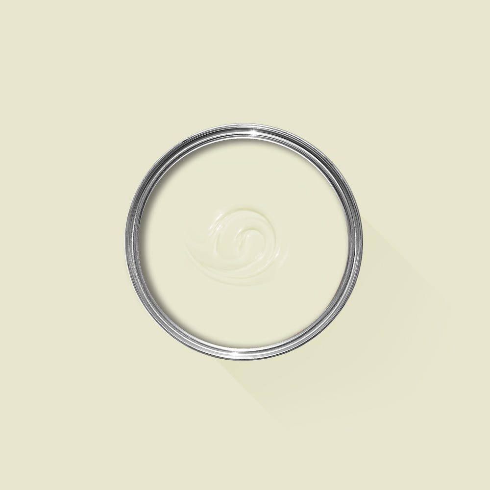 Clear glass lid with metal rim on a beige background
