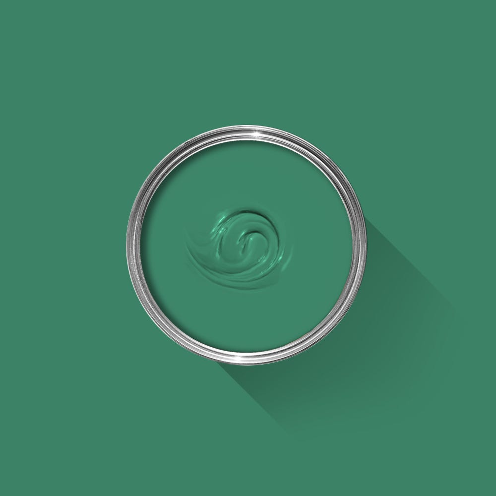 Green paint swatch with a silver ring on a green background