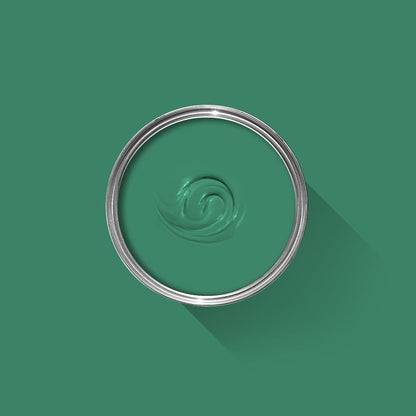 Green paint swatch with a silver ring on a green background