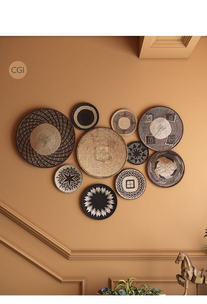 Decorative wall art with woven plates on a beige wall