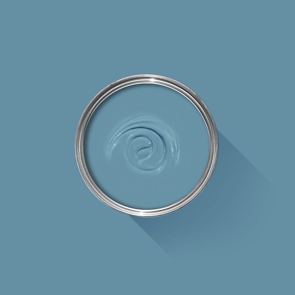 Clear glass bowl with a spiral design on a blue background